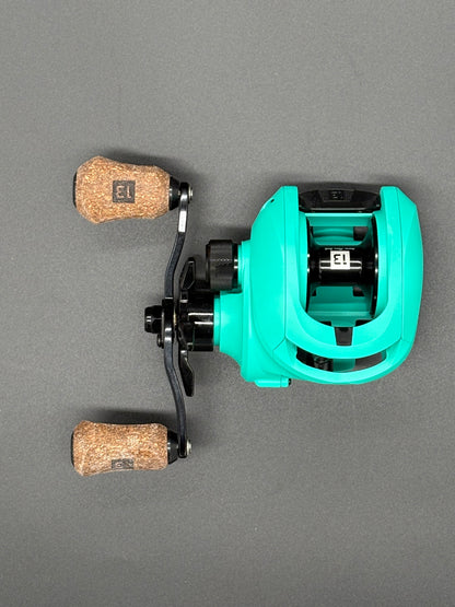 13 Fishing Origin Teal Bait Caster Right Hand 7:3