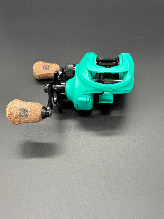 13 Fishing Origin Teal Bait Caster Right Hand 7:3